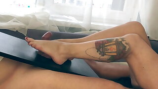 MILF with sexy legs gives FOOTJOB