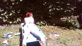 Nicoletta wears a large diaper in a public garden