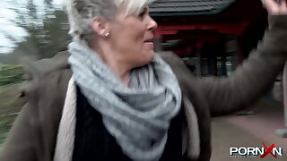 Chesty mature Bree pissing in public